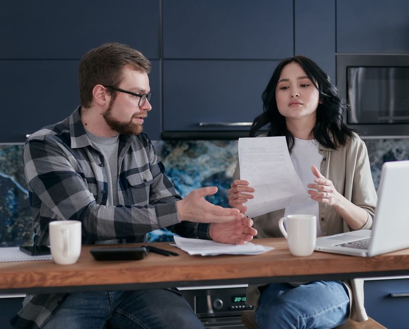 An international couple reviewing documents together