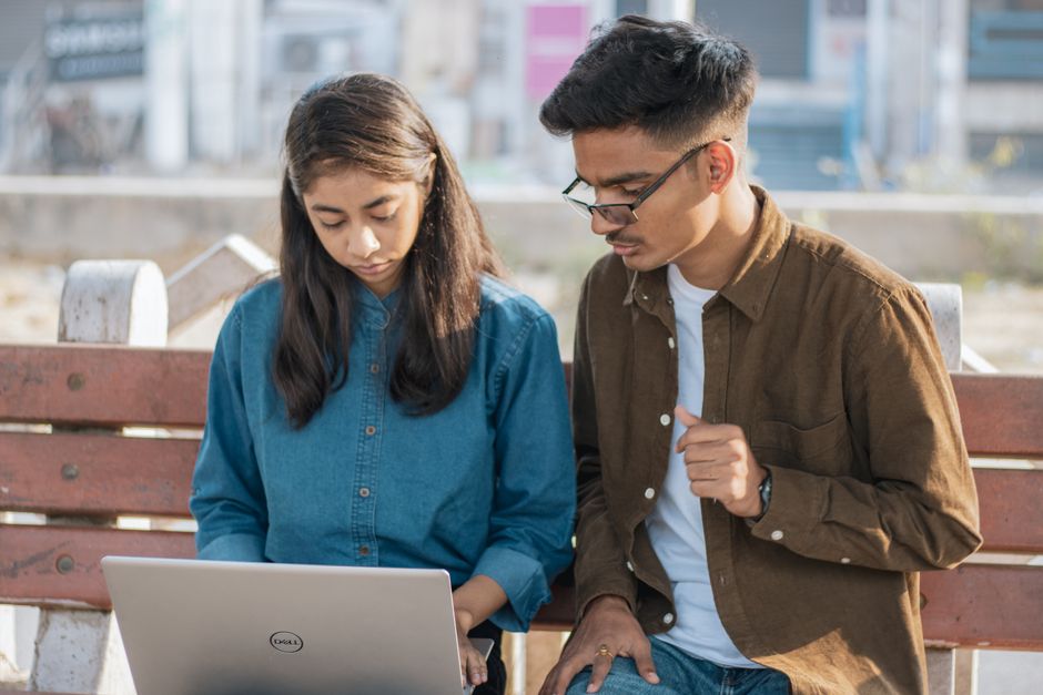 Looking up internship postings on a laptop